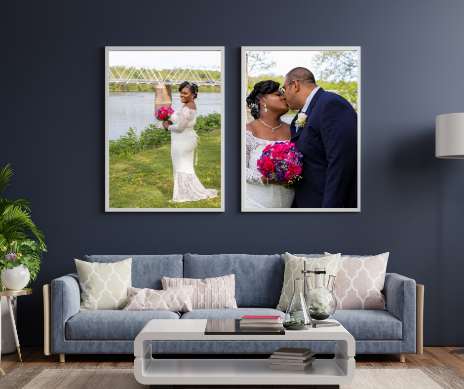 Two large wall art image of a black couple kisses outside.